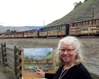 Patricia Banks plein air painting the railway yard in Ashcroft, BC